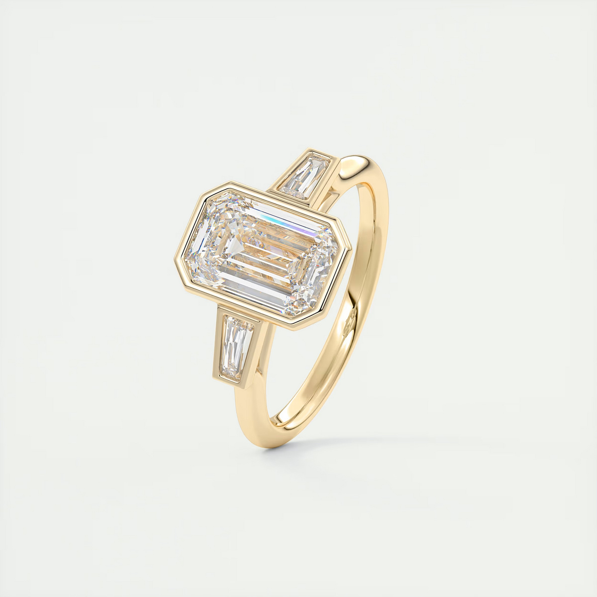 2 Carat Emerald Cut Bezel Set Three-Stone Engagement Ring